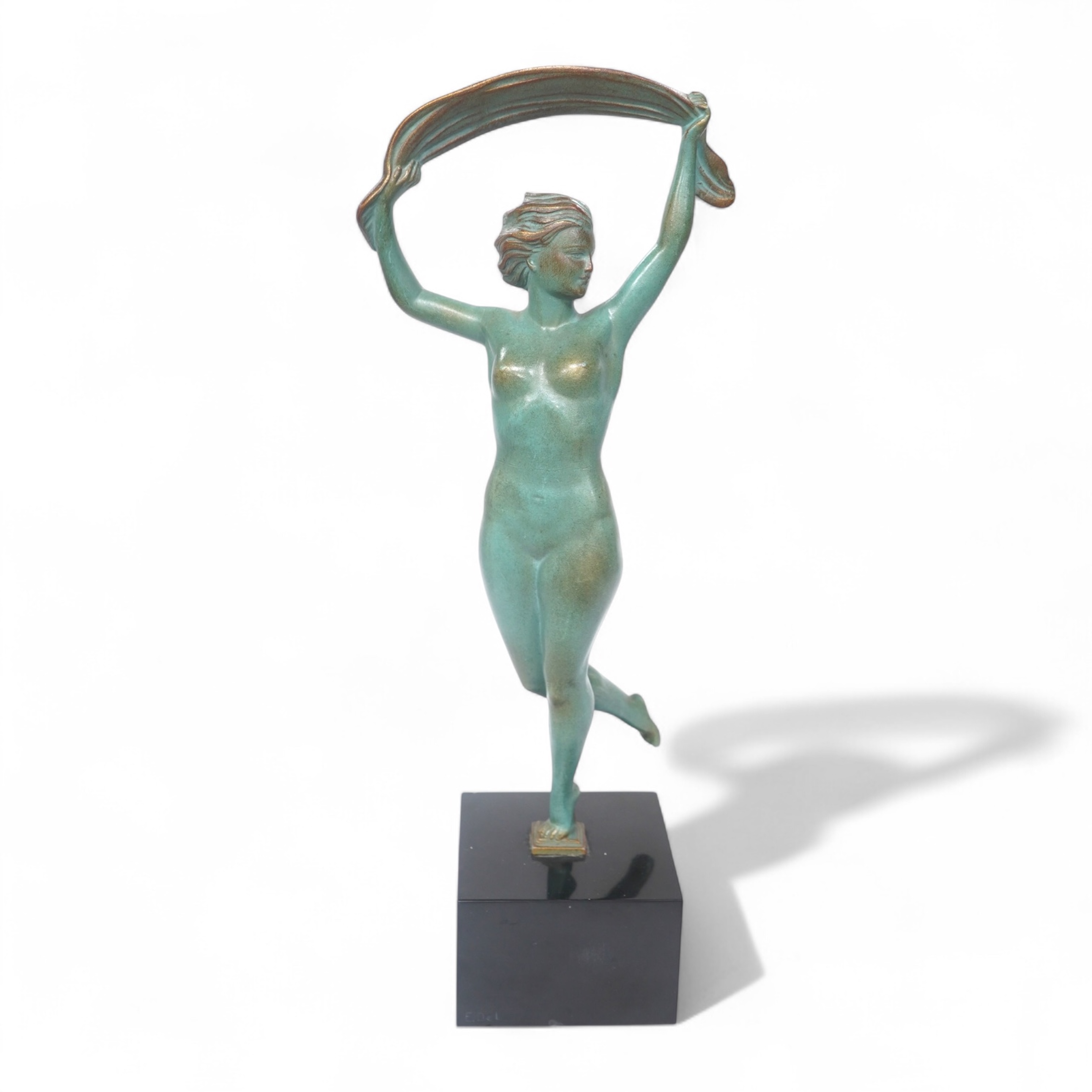 A French Art Deco bronze model of a dancer, green patination, on black marble base. 33cm high. Condition - minor chip to base
